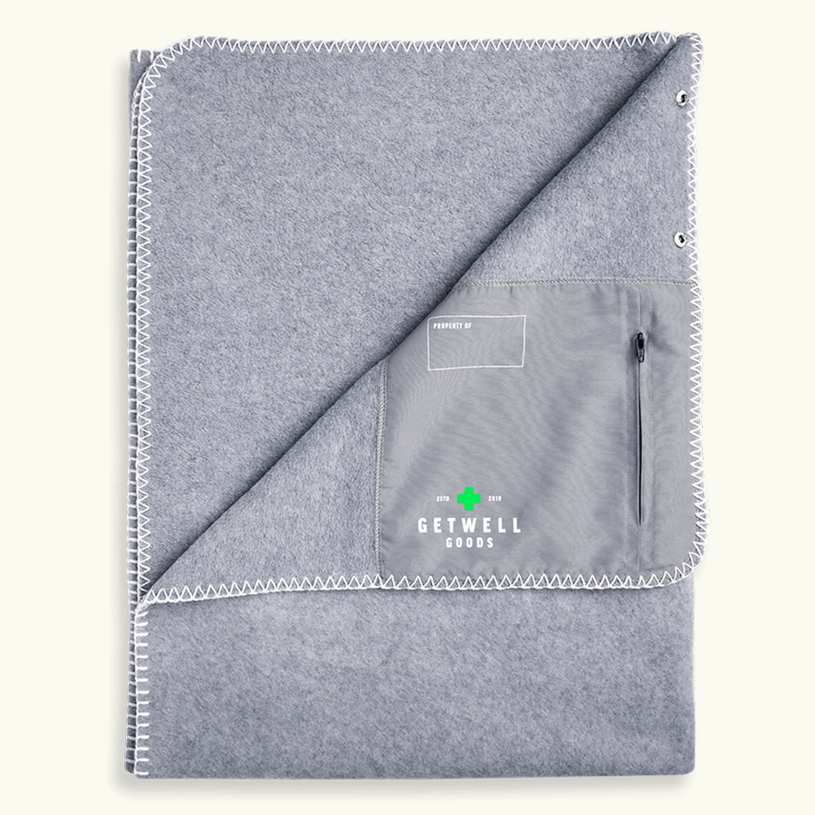 Grey CozyWrap wearable hospital blanket with zip pocket for patient comfort